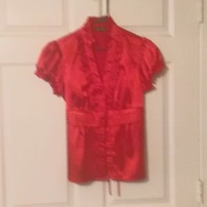 Red blouse, size medium.
